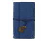 Blue PU vegan leather notebook with a decorative charm on a white background
